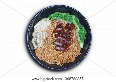 Traditional Chinese Wantan Mee Noodle  Served With Char Siew Braised Pork And Cabbage On Dark Wooden