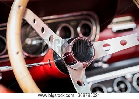 Retro Interior Of Old Automobile, Steering Wheel And Dashboard In Historic Vintage Red Car. Old Vehi