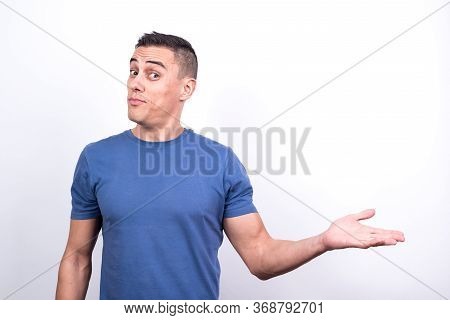 Smiling Man Pointing To Copy Space