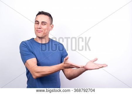 Smiling Man Pointing To Copy Space