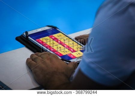 Kyiv, Ukraine - August 6, 2019: Diving Referee Rates A Dive During The Mixed 3m Synchro Final Of The