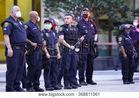 May 29, 2020 - Houston, Texas, USA: Police and spectators collide in downtown Houston, TX as rioters protest the beating and killing of George Floyd by Minneapolis police earlier in the week.