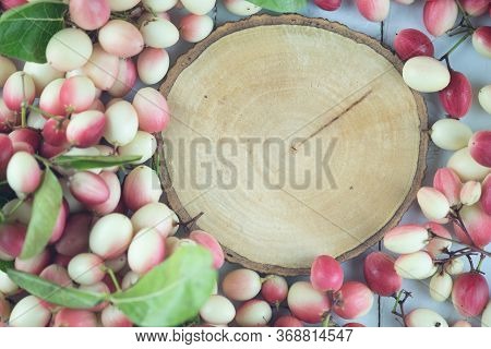 Top View Empty Of Round Wooden Tag With Fresh Carissa Carandas. Flat Lay. Carandas-plum Or Karonda F