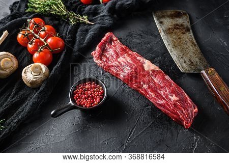 Organic Machete Or Hanger Butcher Steak, Near Butcher Knife With Pink Pepper And Rosemary. Black Bac