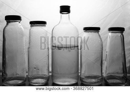 Composition Of Glass Bottles On A Light Background