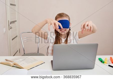 Angry Teenage Girl Learning Touch Typing On Keyboard, Girl Is Typing With Closed Eyes Wearing Sleepi