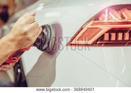 Polishing The Car Body With A Soft Brush With Polishing Paste