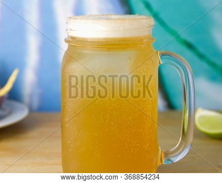 A Mug Of Mexican Michelada Beer. Selective Focus.