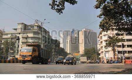Mumbai, India - December 17, 2018: Buildings Of The City Of Mumbai In The Area Of Colaba With Traffi