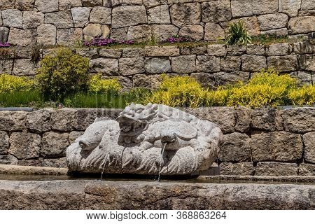 Haeinsa-gil, South Korea; May 26, 2020: Stone Sculpture Fountain Of Fish, Dragon And Turtle At Haein