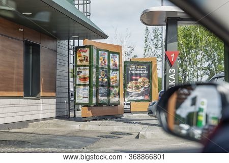 Moscow, Russia, 26/04/2020: Line-up Of Cars And Mcdonald's Take-away. Drive Thru.