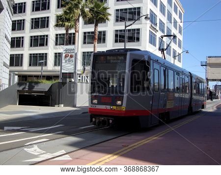 San Francisco - April 6, 2010: T Muni Light-rail Train With Ad On Side On 4th Street In Mission Bay.