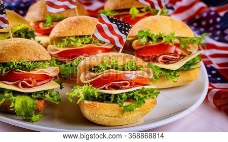 Good Appetizer Ciabatta Roll Sandwiches On White Background With Flag. Independence Day Food Deliver