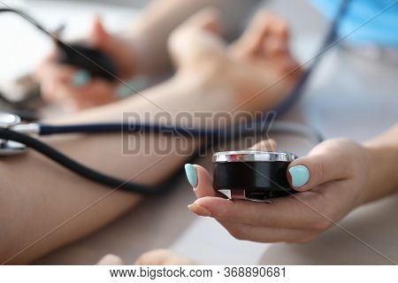 Female Hand Measures Pressure Patient In Clinic. Quality Treatment At Diagnostic Center. Consultatio
