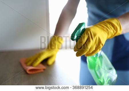 Female Hands In Gloves Disinfect Table At Home. Thorough Cleaning Workplace. Hand Glove Wipes Surfac