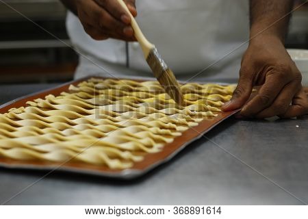 Chef Making Lavash Bread Sticks In Bakery Kitchen