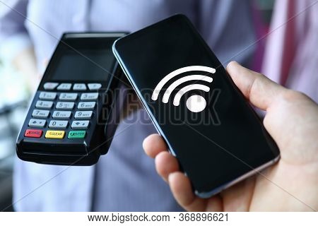 People Hold Portable Terminal And Smartphone. Payment By Contactless Means During Quarantine. Non-co