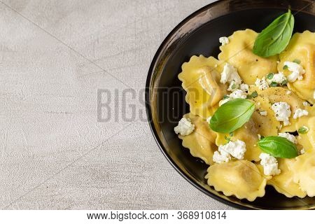 Girasoli Pasta With Soft Cheese, Olive Oil And Basil Leaves On Gray Background. Italian, Mediterrane