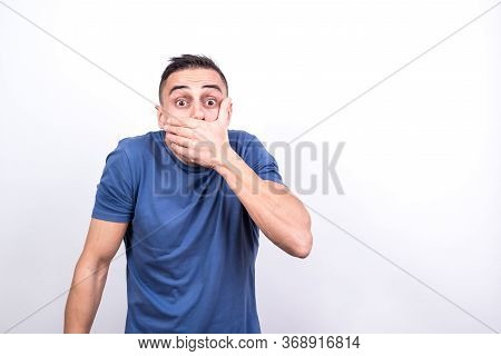 Man Covering His Mouth