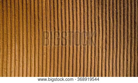 Aerial View ; Rows Of Soil Before Planting. Furrows Row Pattern In A Plowed Field Prepared For Plant