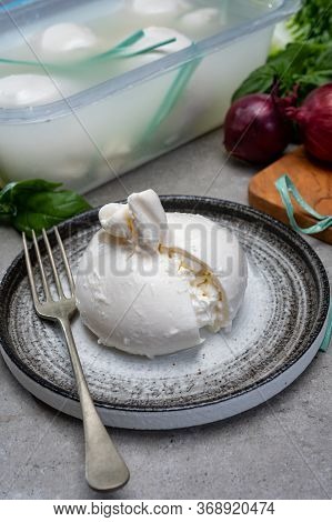 Eating Of Fresh Handmade Soft Italian Cheese From Puglia, White Balls Of Burrata Or Burratina Cheese
