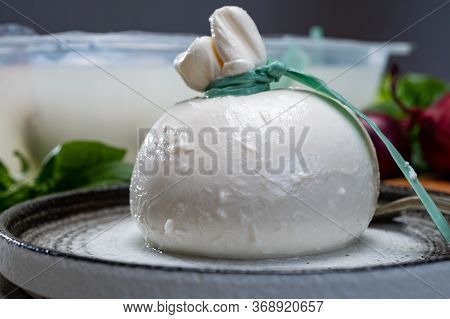 Eating Of Fresh Handmade Soft Italian Cheese From Puglia, White Balls Of Burrata Or Burratina Cheese