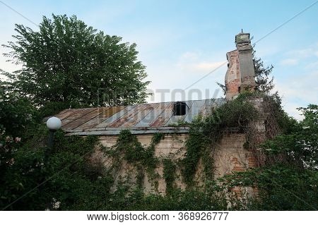 Old Abandoned Chapel In The Forest, Church Lost In The Wood Near Zhytomyr.