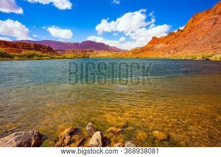 The magnificent Colorado River. Wide river and steep banks of red sandstone. Lee's Ferry is a historic boat ferry. Amazing wildlife. USA. The concept of active, extreme and photo tourism
