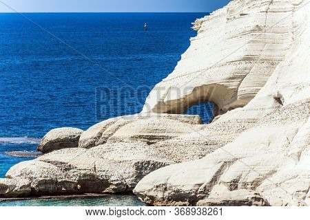 Magnificent color of sea water -  turquoise. Karst cave in the limestone mountain in northern Israel, on the border with Lebanon. The concept of active, environmental and photo tourism