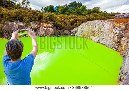 The unique geothermal area of Rotorua. Devil's Bath with bright green water. Volcanic Valley Waimangu, Wai-O-Tapu. New Zealand, North Island. Extreme, exotic and photo tourism concept