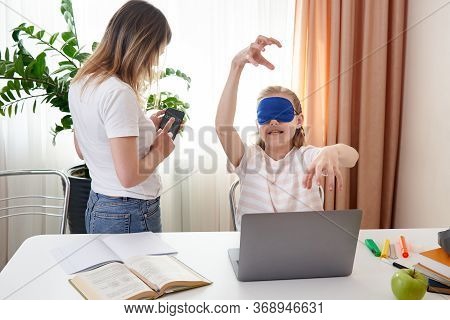 Mother Helping Teenage Daughter To Learn Touch Typing On Keyboard, Girl Is Typing With Closed Eyes W