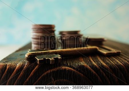 Key And Cuffs On An Old Wooden Texture Table, Closeup