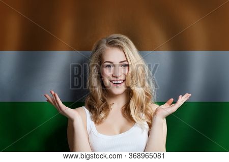 Beautiful Happy Young Woman Against The India Flag Background. Live, Education And Work In India