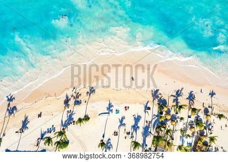Aerial Drone View Of Beautiful Atlantic Tropical Beach With Palms And Straw Umbrellas. Bavaro, Punta