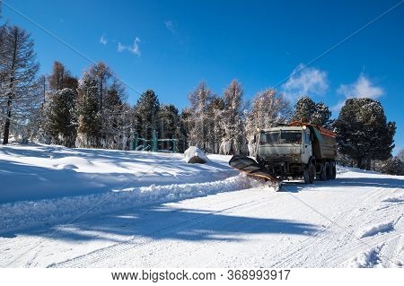 Altay, Russia - February 25, 2018: View Of Kamaz Cleaning The Road In The Winter, Altay Mountains, S