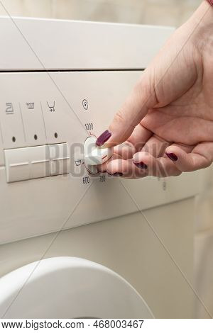 A Person Chooses A Washing Mode With A Switch. Washing Mode. Temperature Mode.