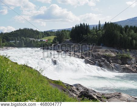 Laksforsen Waterfall At Vefsna River On European Grane Village In Nordland Region In Norway, Clear B