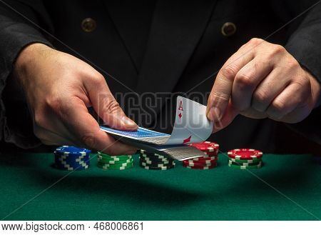 A Card Sharper Pulls An Ace Of Diamonds From A Deck Of Playing Cards While Playing Poker. The Concep