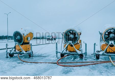 Snow Cannons Spray Artificial Snow Crystals. Production Of Artificial Snow. Cars Make Snow. Snow Gun