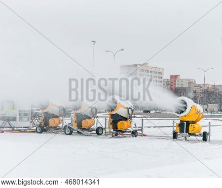 Snow Cannons Spray Artificial Snow Crystals. Production Of Artificial Snow. Snow Guns. Cars Make Sno