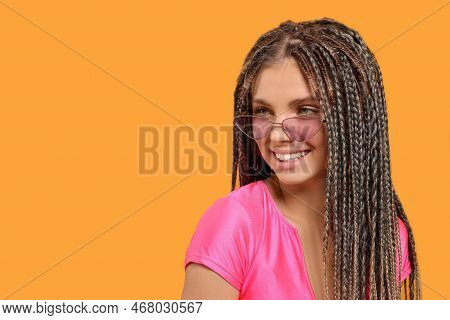 Beautiful Woman With Long African Braids On Yellow Background, Space For Text
