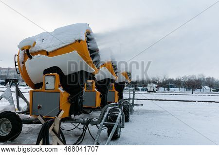 Snow Cannons Spray Artificial Snow Crystals. Production Of Artificial Snow. Cars Make Snow. Snow Gun