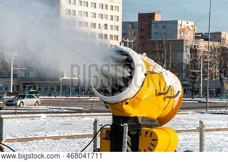 Snow Cannon Sprays Artificial Snow Crystals. Production Of Artificial Snow. The Machine Makes Snow. 