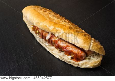 Bosna Or Bosner, A Spicy Austrian Hot Dog Style Fast Food Dish With A Bratworst, Onions, Ketchup And