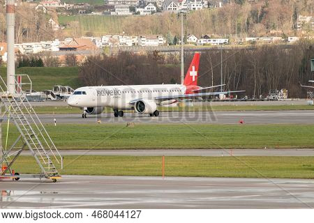 Zurich, Switzerland, December 23, 2022 Helvetic Airlines Embraer E195-e2 Aircraft Is Taxiing To Its 
