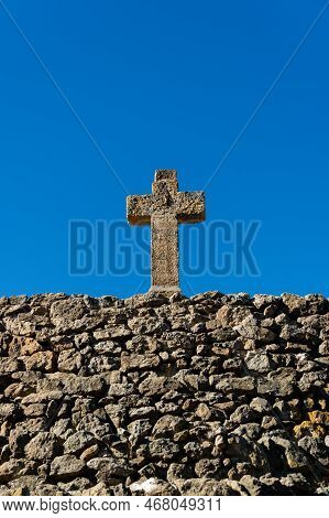 Old Stone Cross And Old Brick Stone Wall With Blue Sky - Religious Background