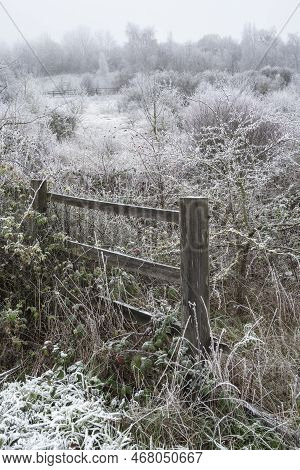Beautiful Wintry Landscape Image Of Forest In English Countryside Covered In Hoarfrost