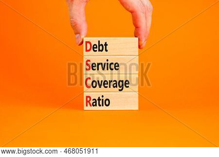 Dscr Debt Service Coverage Ratio Symbol. Concept Words Dscr Debt Service Coverage Ratio On Wooden Bl