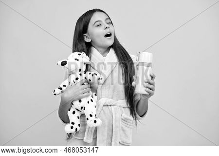 Childhood Happiness. Good Morning. Sleepy Kid Wear Nightsuit Play With Toy. Child In Cozy Sleepwear.