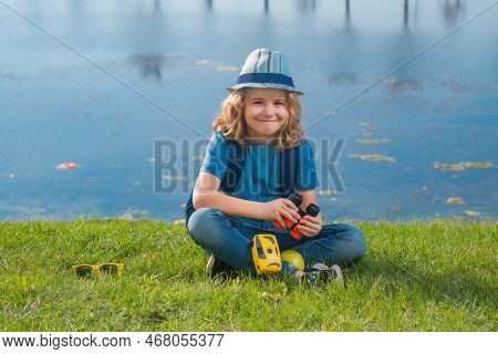 Scout Boy Wearing Explorer Hat And Backpack Outdoor. Explorer And Adventure With Binocular.